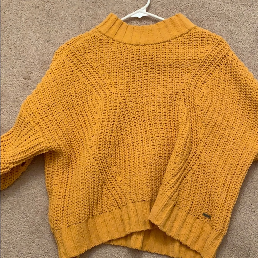 yellow sweater